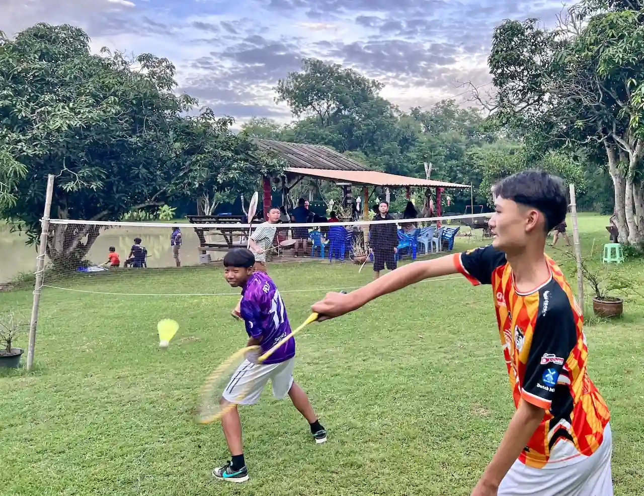 Two players in a badminton game at Camp 99