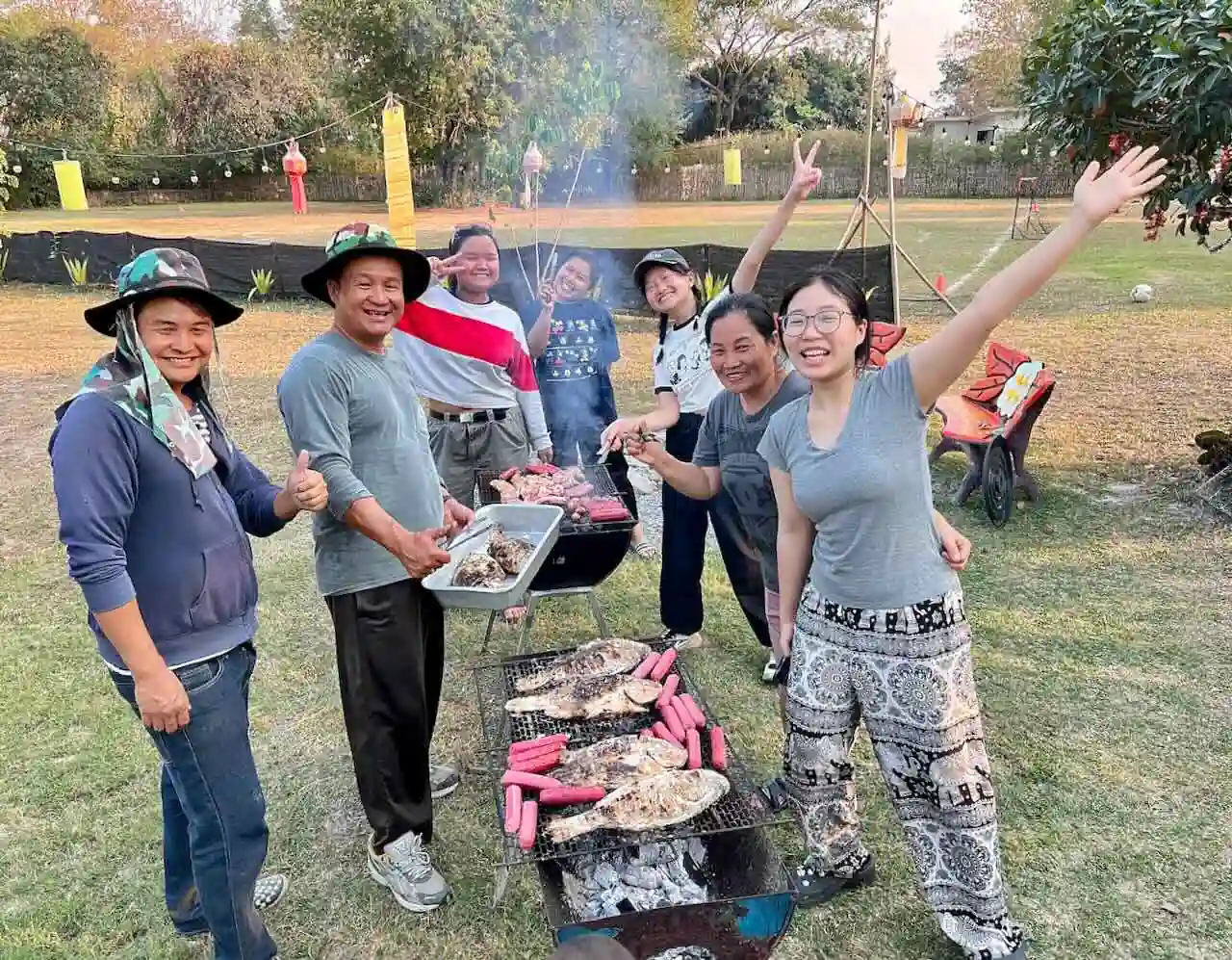 Friends grilling a BBQ together at Camp 99