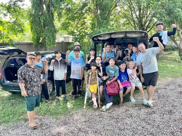A group photo in the Camp 99 parking area